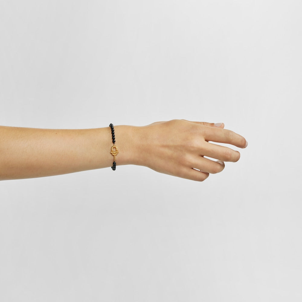 Bracelet with 18kt gold plating over silver and onyx MANIFESTO