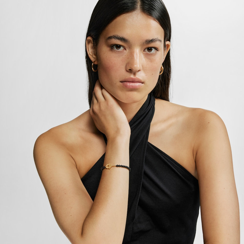 Bracelet with 18kt gold plating over silver and onyx MANIFESTO