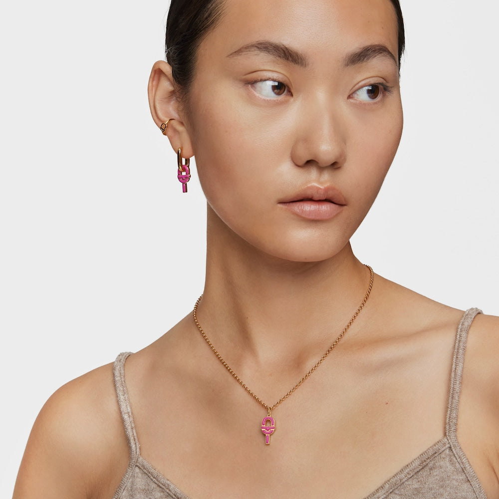 Medium Pendant with 18kt gold plating over silver and fuchsia-colored enamel MANIFESTO