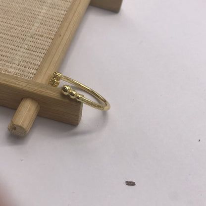 Small open Ring with  plating over silver and motifs Grain