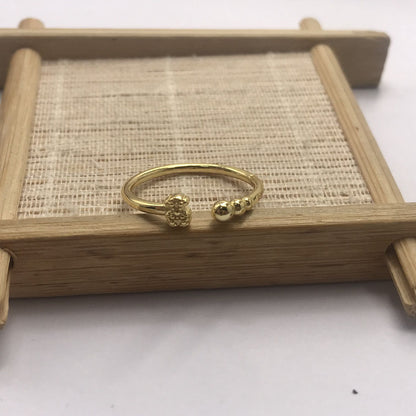 Small open Ring with  plating over silver and motifs Grain