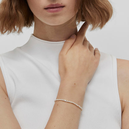 Elastic Bold Motif Bracelet with cultured pearls and flower motifs in silver |