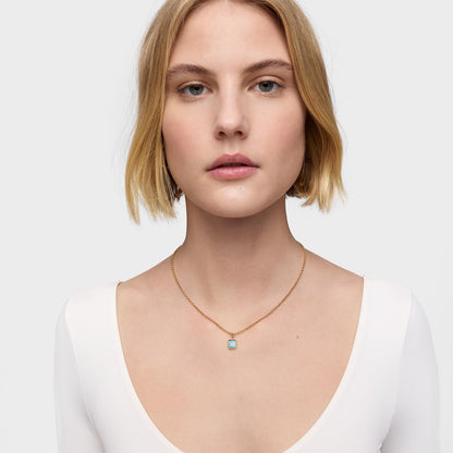 Small  plating over silver Pendant with topaz Medallions |