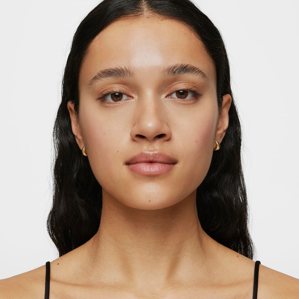 Short, thick Hoop earrings with 18kt gold plating over silver