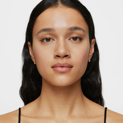 Short, thick Hoop earrings with 18kt gold plating over silver